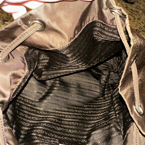 Prada backpack. Pre loved. Brown in color. Pockets inside and outside. - Picture 4 of 12
